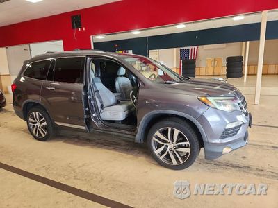Czwarte zdjęcie samochodu z boku: 2016 HONDA PILOT TOURING VIN:5FNYF6H9XGB057664 - miniatura