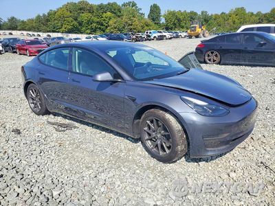 Czwarte zdjęcie samochodu z boku: 2023 TESLA MODEL 3 VIN:5YJ3E1EA7PF385509 - miniatura