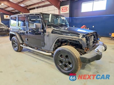 Czwarte zdjęcie samochodu z boku: 2012 JEEP WRANGLER UNLIMITED SAHARA VIN:1C4BJWEG9CL134538 - miniatura