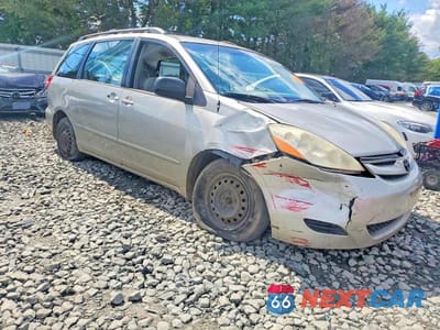 Czwarte zdjęcie samochodu z boku: 2010 TOYOTA SIENNA CE 7-PASSENGER VIN:5TDKK4CC4AS311302 - miniatura
