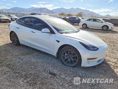 Czwarte zdjęcie samochodu z boku: 2022 TESLA MODEL 3 VIN:5YJ3E1EB1NF184095 - miniatura