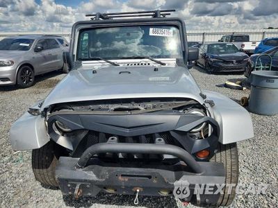 Piąte zdjęcie samochodu w środku: 2009 JEEP WRANGLER SAHARA VIN:1J4FA541X9L703750 - miniatura