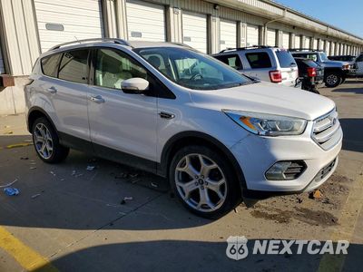 Czwarte zdjęcie samochodu z boku: 2017 FORD ESCAPE TITANIUM VIN:1FMCU9J90HUB20996 - miniatura