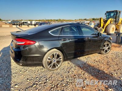 Trzecie zdjęcie samochodu z tyłu: 2017 FORD FUSION TITANIUM VIN:3FA6P0K95HR109797 - miniatura