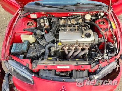 Zdjęcie 11 z 12 samochodu: 1999 MITSUBISHI ECLIPSE SPYDER GS VIN:4A3AX35G6XE134531 - miniatura
