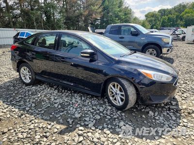 Czwarte zdjęcie samochodu z boku: 2017 FORD FOCUS SE VIN:1FADP3F2XHL348041 - miniatura