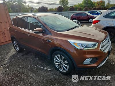 Czwarte zdjęcie samochodu z boku: 2017 FORD ESCAPE TITANIUM VIN:1FMCU9J9XHUE25356 - miniatura
