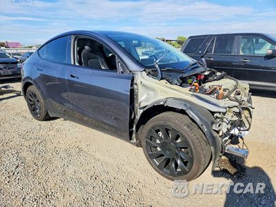 Czwarte zdjęcie samochodu z boku: 2022 TESLA MODEL Y VIN:7SAYGAEE8NF420335 - miniatura