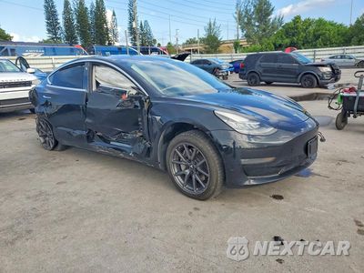 Czwarte zdjęcie samochodu z boku: 2019 TESLA MODEL 3 VIN:5YJ3E1EBXKF441847 - miniatura