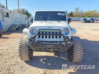 Piąte zdjęcie samochodu w środku: 2015 JEEP WRANGLER UNLIMITED SPORT VIN:1C4BJWDG0FL666170 - miniatura