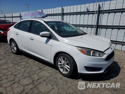 Czwarte zdjęcie samochodu z boku: 2018 FORD FOCUS SE VIN:1FADP3F24JL293382 - miniatura