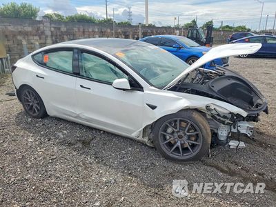 Czwarte zdjęcie samochodu z boku: 2022 TESLA MODEL 3 VIN:5YJ3E1EB4NF178064 - miniatura