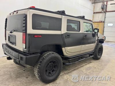 Czwarte zdjęcie samochodu z boku: 2006 HUMMER H2 VIN:5GRGN23U36H107725 - miniatura