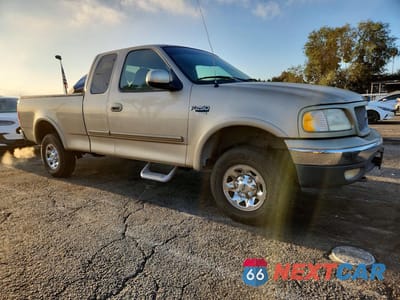 Czwarte zdjęcie samochodu z boku: 1999 FORD F250 VIN:1FTPX28L1XKB20750 - miniatura