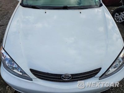 Zdjęcie 11 z 12 samochodu: 2004 TOYOTA CAMRY LE VIN:JTDBE32K640286436 - miniatura