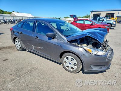 Czwarte zdjęcie samochodu z boku: 2017 FORD FOCUS S VIN:1FADP3E26HL326488 - miniatura