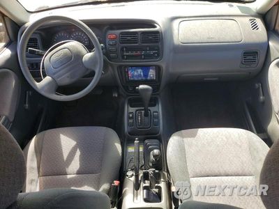 Zdjęcie 8 z 13 samochodu: 2000 CHEVROLET TRACKER VIN:2CNBJ13C1Y6953252 - miniatura