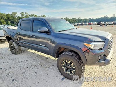 Czwarte zdjęcie samochodu z boku: 2023 TOYOTA TACOMA TRD OFF-ROAD VIN:3TMCZ5AN2PM537633 - miniatura