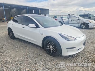 Czwarte zdjęcie samochodu z boku: 2022 TESLA MODEL 3 VIN:5YJ3E1EB3NF132418 - miniatura