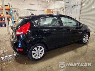 Trzecie zdjęcie samochodu z tyłu: 2012 FORD FIESTA SE VIN:3FADP4EJ3CM118184 - miniatura