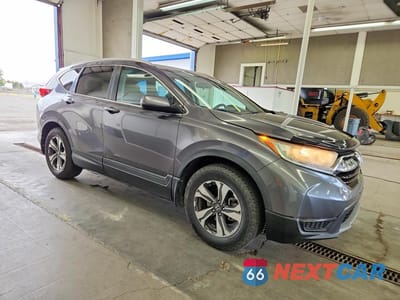 Czwarte zdjęcie samochodu z boku: 2017 HONDA CR-V LX VIN:2HKRW1H38HH000787 - miniatura