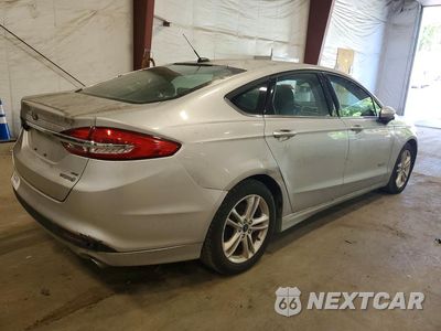 Trzecie zdjęcie samochodu z tyłu: 2018 FORD FUSION SE HYBRID VIN:3FA6P0LU6JR173694 - miniatura