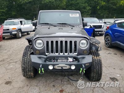 Piąte zdjęcie samochodu w środku: 2017 JEEP WRANGLER UNLIMITED SAHARA VIN:1C4BJWEG2HL507667 - miniatura