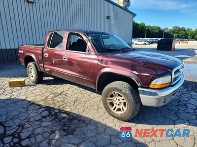 Czwarte zdjęcie samochodu z boku: 2004 DODGE DAKOTA QUAD SLT VIN:1D7HG48N34S622601 - miniatura