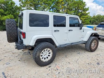 Trzecie zdjęcie samochodu z tyłu: 2012 JEEP WRANGLER UNLIMITED SAHARA VIN:1C4BJWEG4CL103648 - miniatura