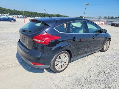 Trzecie zdjęcie samochodu z tyłu: 2017 FORD FOCUS TITANIUM VIN:1FADP3N27HL330856 - miniatura