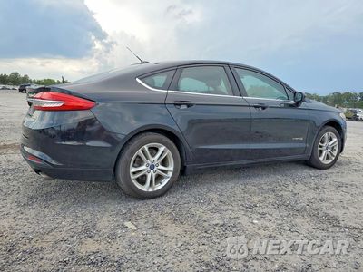 Trzecie zdjęcie samochodu z tyłu: 2018 FORD FUSION SE HYBRID VIN:3FA6P0LU9JR171048 - miniatura