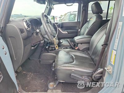 Zdjęcie 7 z 12 samochodu: 2015 JEEP WRANGLER UNLIMITED SAHARA VIN:1C4BJWEGXFL561781 - miniatura