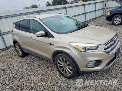 Czwarte zdjęcie samochodu z boku: 2017 FORD ESCAPE TITANIUM VIN:1FMCU0J95HUE76646 - miniatura