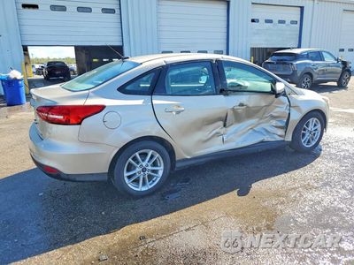 Trzecie zdjęcie samochodu z tyłu: 2017 FORD FOCUS SE VIN:1FADP3F23HL212575 - miniatura