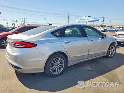 Trzecie zdjęcie samochodu z tyłu: 2018 FORD FUSION S HYBRID VIN:3FA6P0UU7JR273575 - miniatura