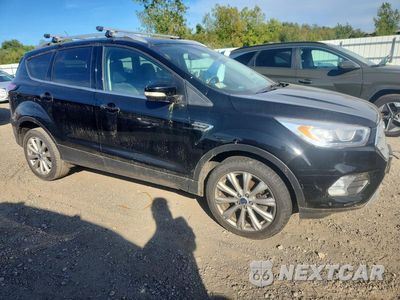 Czwarte zdjęcie samochodu z boku: 2017 FORD ESCAPE TITANIUM VIN:1FMCU9J98HUB46777 - miniatura