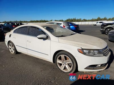 Czwarte zdjęcie samochodu z boku: 2013 VOLKSWAGEN CC SPORT VIN:WVWBP7AN4DE568655 - miniatura
