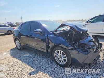 Czwarte zdjęcie samochodu z boku: 2016 SCION IA BASE VIN:3MYDLBZV8GY133304 - miniatura