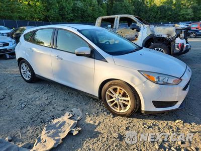 Czwarte zdjęcie samochodu z boku: 2017 FORD FOCUS SE VIN:1FADP3K20HL323106 - miniatura
