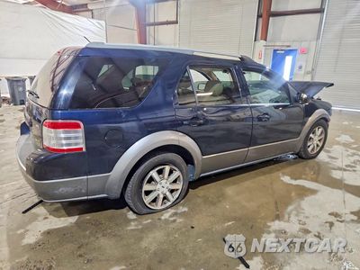 Trzecie zdjęcie samochodu z tyłu: 2009 FORD TAURUS X SEL VIN:1FMDK02W79GA03460 - miniatura