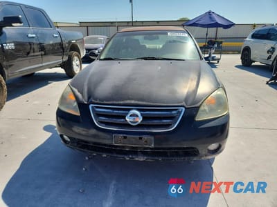 Piąte zdjęcie samochodu w środku: 2002 NISSAN ALTIMA 3.5 SE VIN:1N4BL11D22C119067 - miniatura