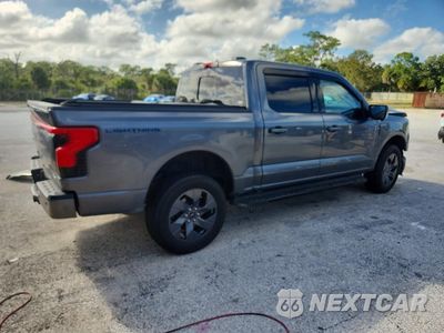 Trzecie zdjęcie samochodu z tyłu: 2022 FORD F150 LIGHTNING PRO VIN:1FTVW1EL1NWG16257 - miniatura