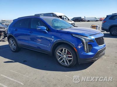 Czwarte zdjęcie samochodu z boku: 2021 CADILLAC XT4 SPORT VIN:1GYFZER43MF074948 - miniatura