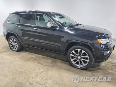 Czwarte zdjęcie samochodu z boku: 2017 JEEP GRAND CHEROKEE OVERLAND VIN:1C4RJFCT4HC631003 - miniatura