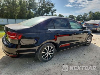 Trzecie zdjęcie samochodu z tyłu: 2017 VOLKSWAGEN JETTA SE VIN:3VWDB7AJ4HM296822 - miniatura