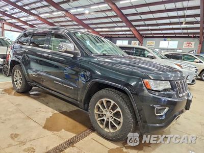 Czwarte zdjęcie samochodu z boku: 2014 JEEP GRAND CHEROKEE OVERLAND VIN:1C4RJFCM1EC298229 - miniatura
