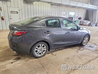 Trzecie zdjęcie samochodu z tyłu: 2016 SCION IA BASE VIN:3MYDLBZV9GY127172 - miniatura