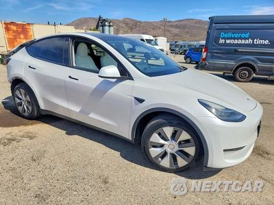 Czwarte zdjęcie samochodu z boku: 2023 TESLA MODEL Y VIN:7SAYGDEE9PA107604 - miniatura