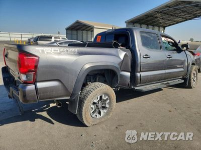 Trzecie zdjęcie samochodu z tyłu: 2019 TOYOTA TACOMA TRD OFF-ROAD VIN:3TMDZ5BN7KM063884 - miniatura