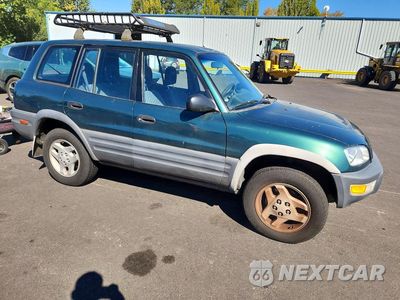 Czwarte zdjęcie samochodu z boku: 1998 TOYOTA RAV4 BASE VIN:JT3GP10V8W0020215 - miniatura